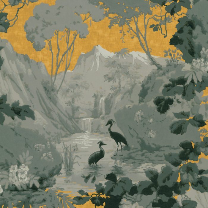 Mountain Cranes features two birds by a stream in a lush, forested landscape with mountains and a yellow sky—vintage wallpaper charm that’s perfect inspiration for set design.