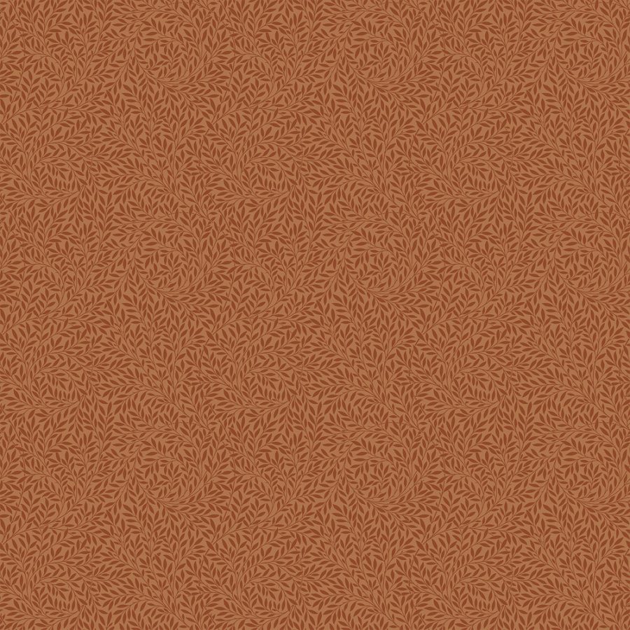 Willow in Terra Cotta features a seamless pattern of small leaf-like shapes in orange and rust tones, inspired by Victorian wallpaper and William Morris—ideal for refined set design.